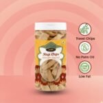 Healthy roasted ragi chips in a transparent plastic jar, nutritional snacks photography.