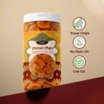 Crunchy Carrot Chips in a transparent glass jar. Healthy dehydrated carrot slices served as crunchy chips in a clear container. Organic carrot chips snack, gluten-free and healthy vegetable crisps.