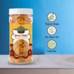 "Crunchy Jowar chips (Sorghum chips) in a clear transparent jar, healthy gluten-free snack photography, white background."