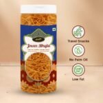 "Crispy Jowar Bhujia snacks in a clear premium jar, healthy gluten-free indian namkeen photography."